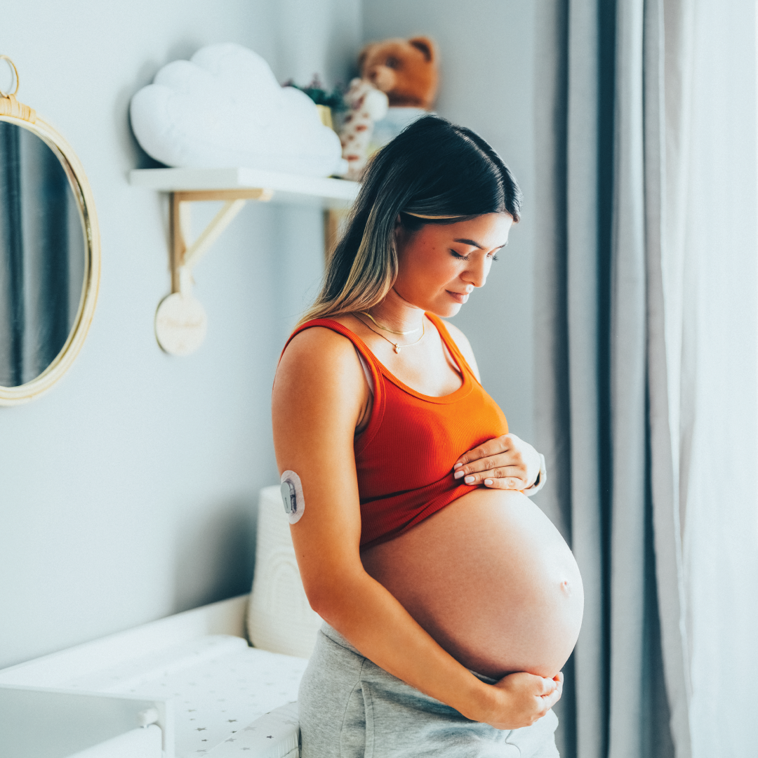 Pregnant woman with a continuous glucose monitor.